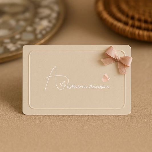 Aesthetic Aangan digital gift card on beige background with blush ribbon and blurred rattan tray in the background.