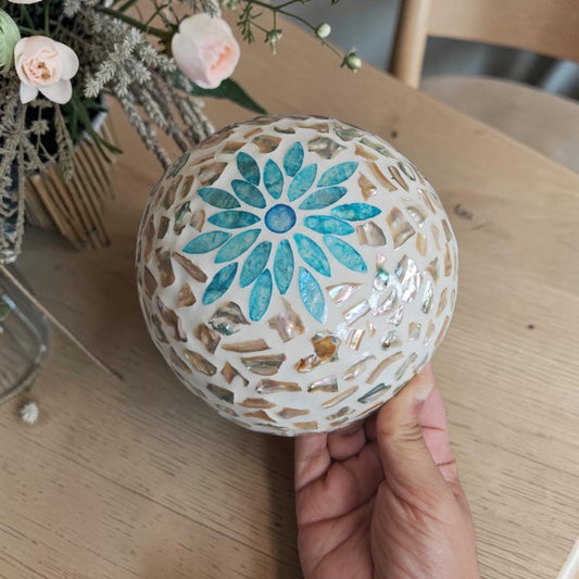 Aqua Bloom Coconut Bowl with aqua floral mother-of-pearl exterior and natural coconut shell base