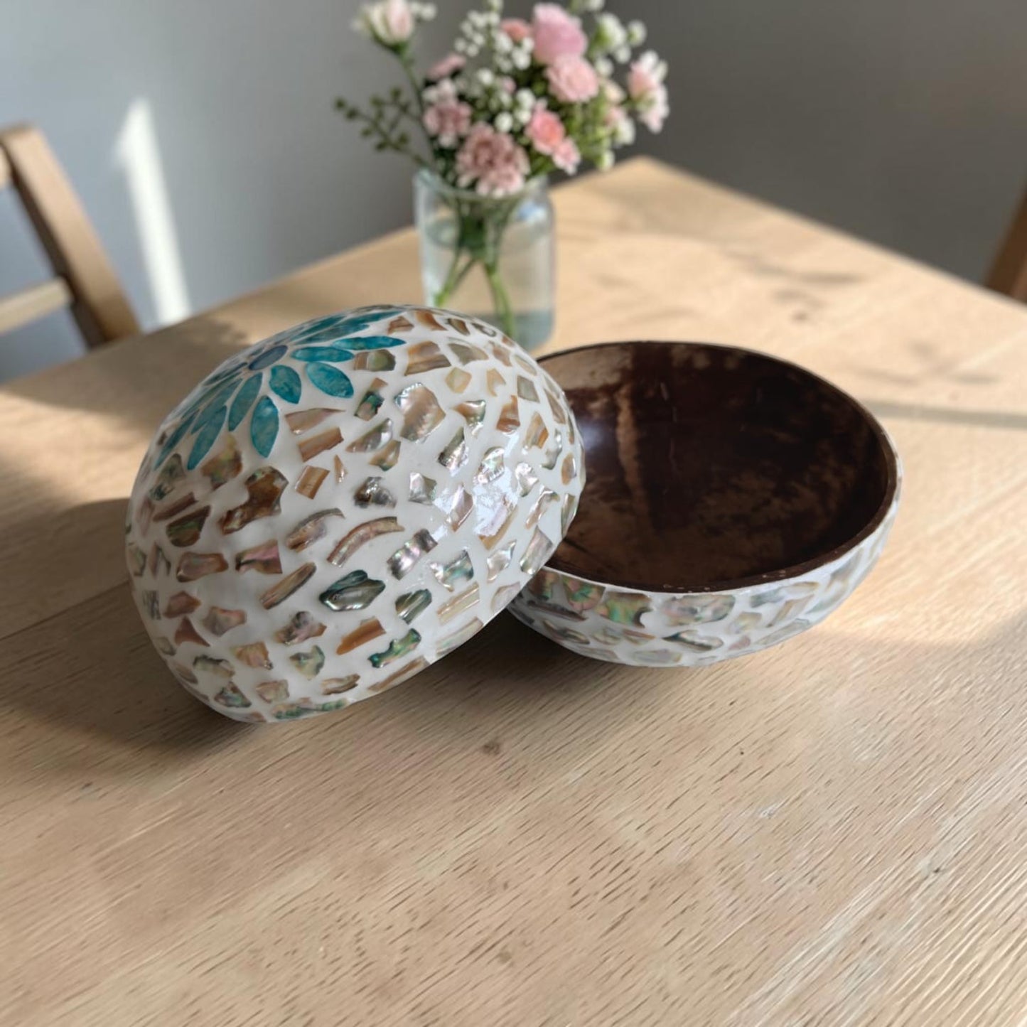 Set of 2 Aqua Bloom Coconut Bowls showing natural coconut interior and mother-of-pearl exterior