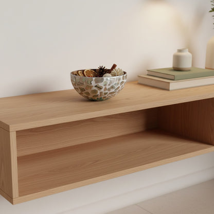 Aqua Bloom Coconut Bowl styled on a wooden shelf in a neutral home setting