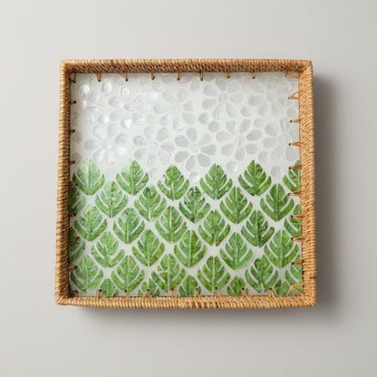 Square rattan tray with green leaf mother-of-pearl mosaic, photographed on a off white background