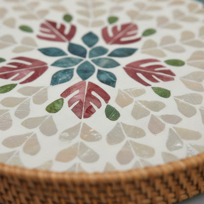 Close-up of handwoven rattan rim on Blush Leaf round tray