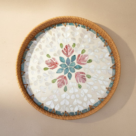 Blush Leaf round mother-of-pearl tray with rattan rim shown from top view
