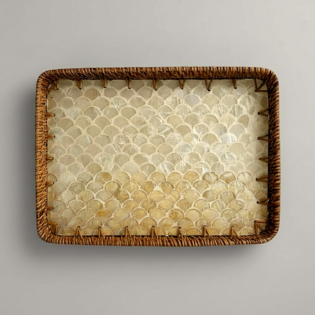 Coastal Pearl rectangular tray in authentic mother-of-pearl with hand-woven rattan rim on grey backdrop