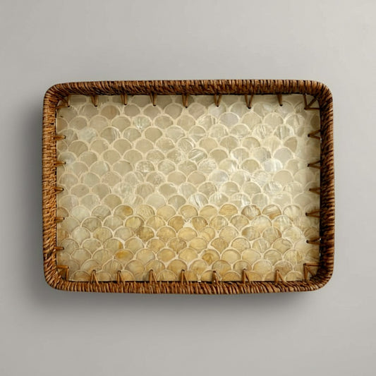 Coastal Pearl rectangular tray in authentic mother-of-pearl with hand-woven rattan rim on grey backdrop