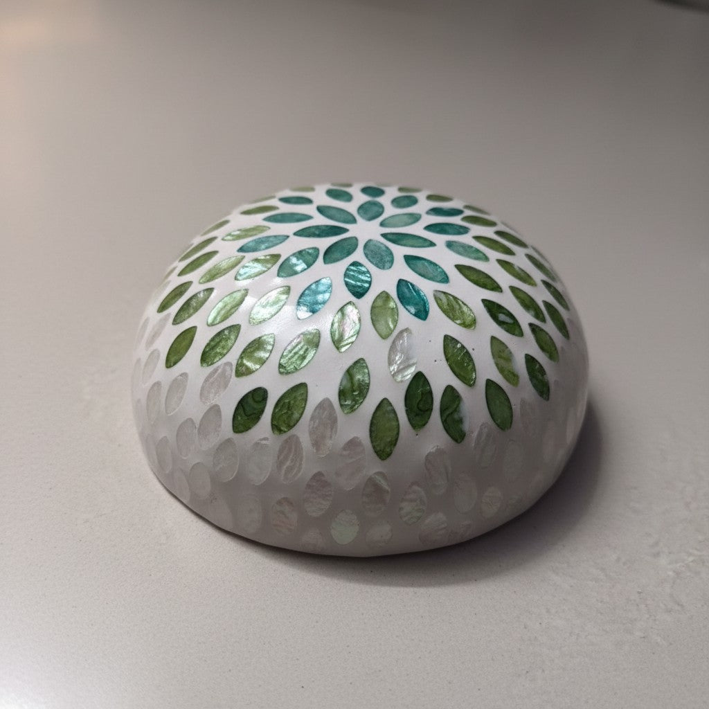 Close-up of Emerald Petal Coconut Bowl with aqua green mother-of-pearl floral inlay