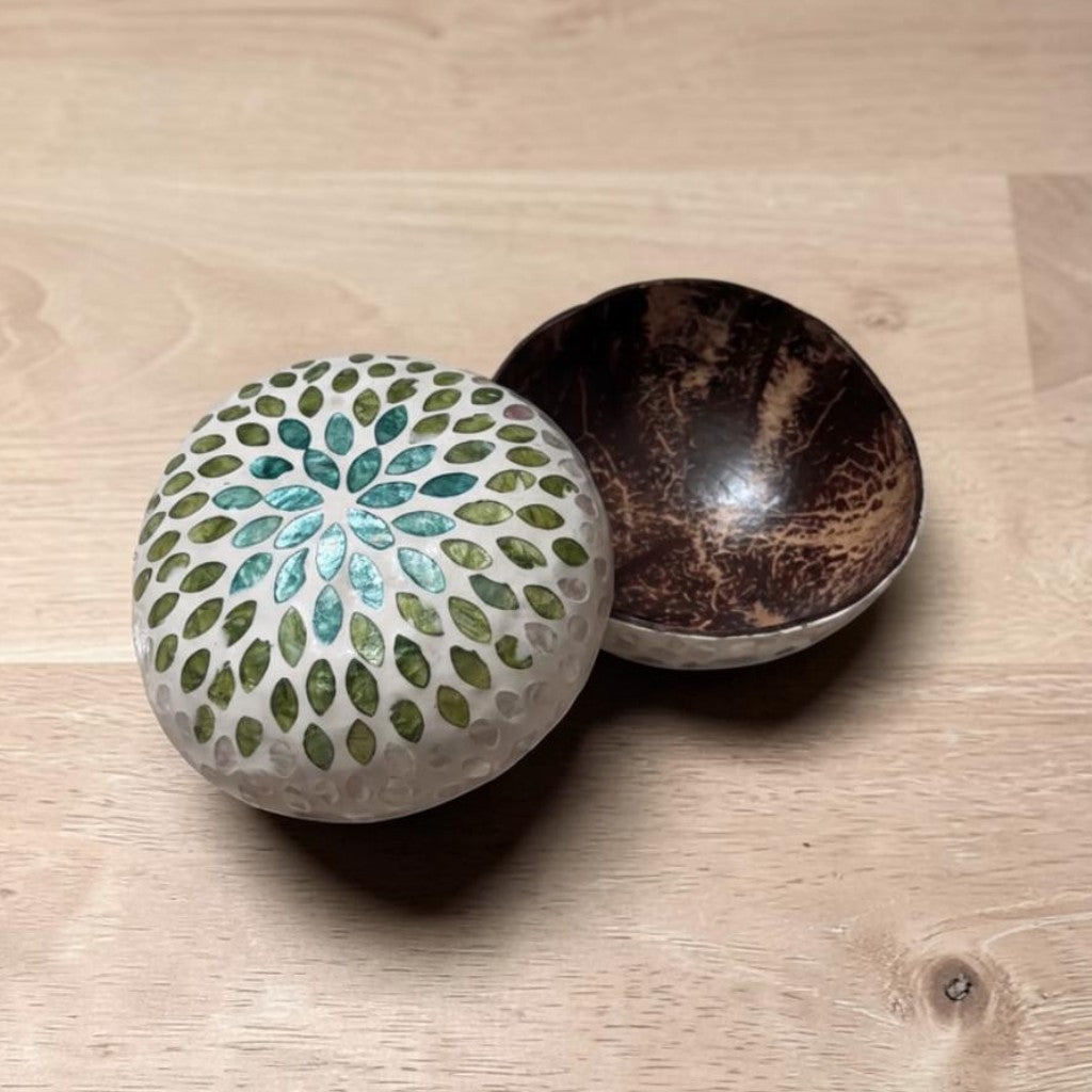 Set of 2 handcrafted coconut bowls showing natural variation in shape, shell tone and inlay placement