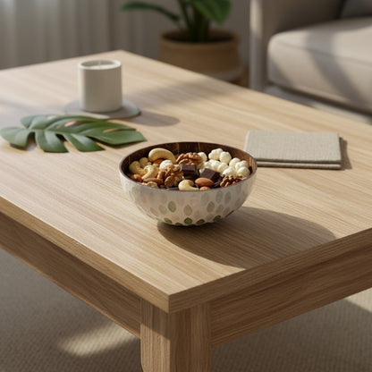 Emerald Petal Coconut Bowl styled with dry snacks on a coffee table
