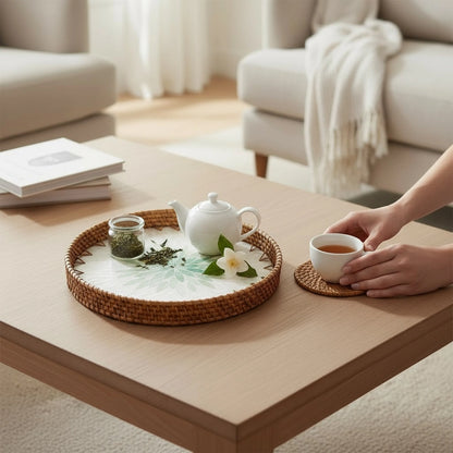 Mother-of-pearl rattan tray on a living-room coffee table with tea set — lifestyle styling