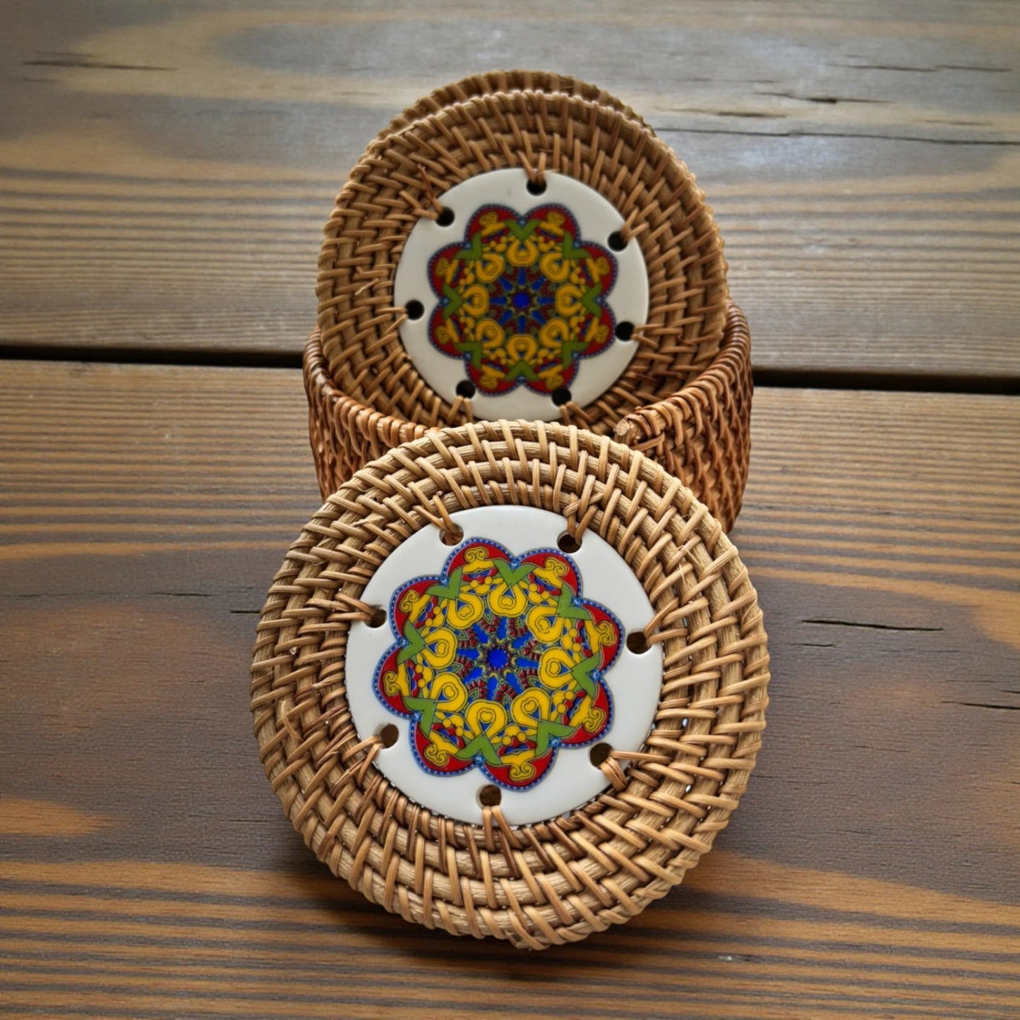 Golden Orbit Ceramic Rattan Coasters on a wooden centre table background