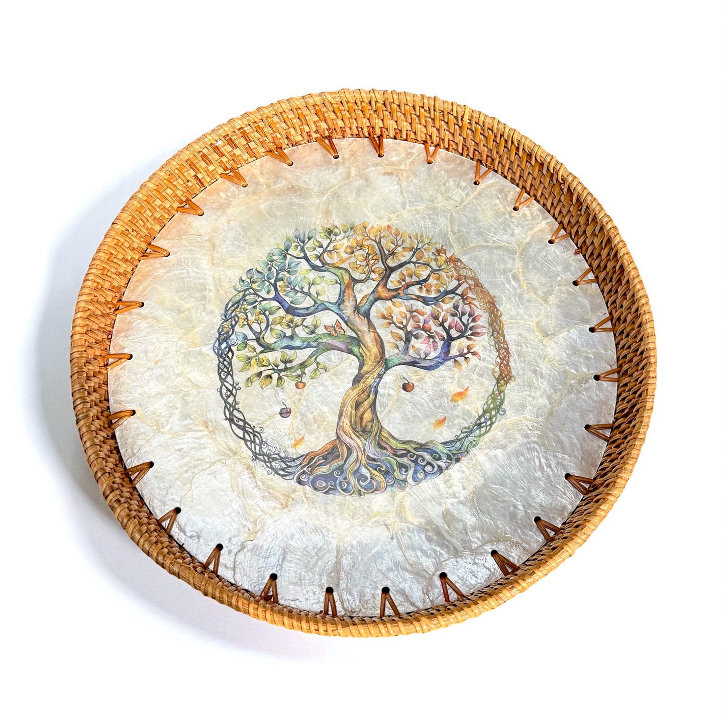 Round Tree of Life tray with mother-of-pearl mosaic and hand-woven rattan rim on white background