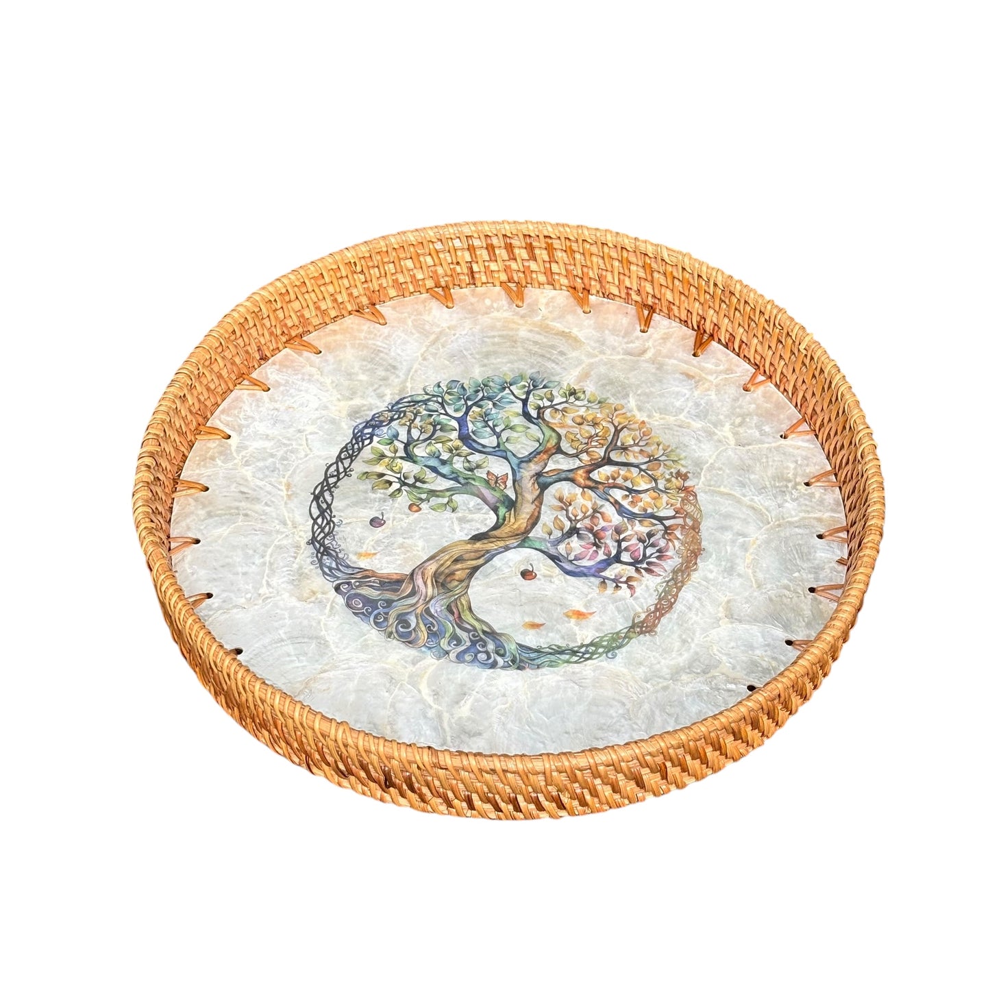 Round woven rattan tray with a tree of life mosaic on a white background