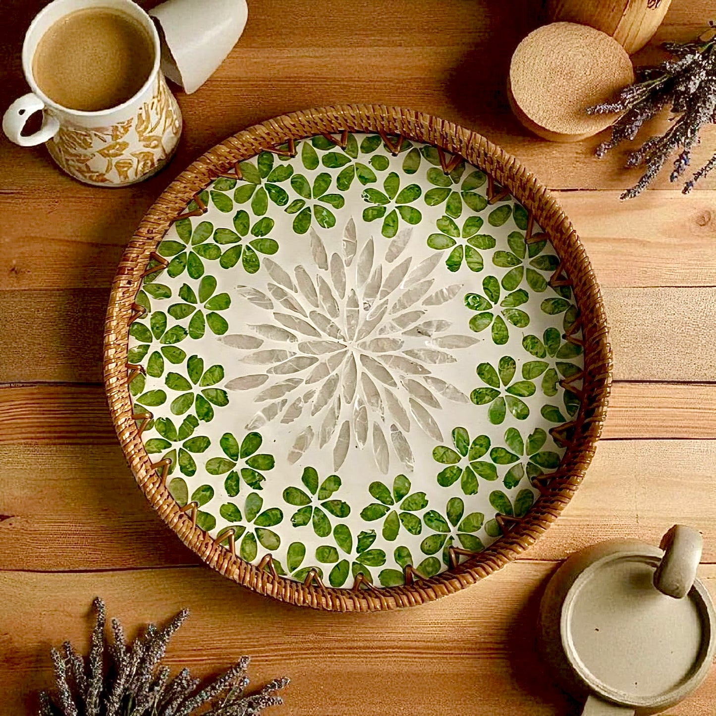 Round decorative tray for coffee table – green mother-of-pearl mosaic with rattan rim, styled with a tea set.