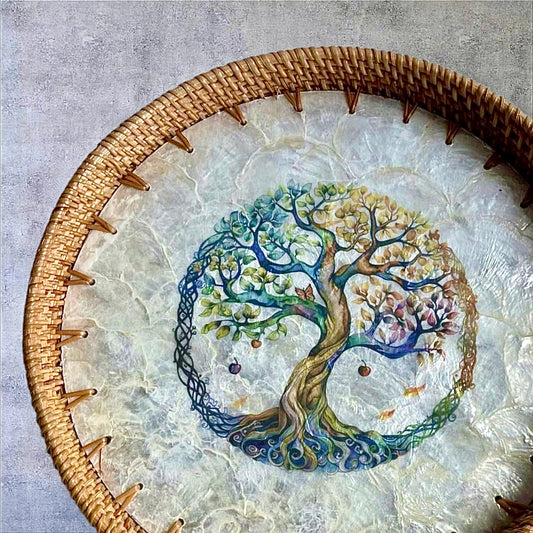 Close-up of Tree of Life mother-of-pearl mosaic tray showing scalloped edge and rattan rim