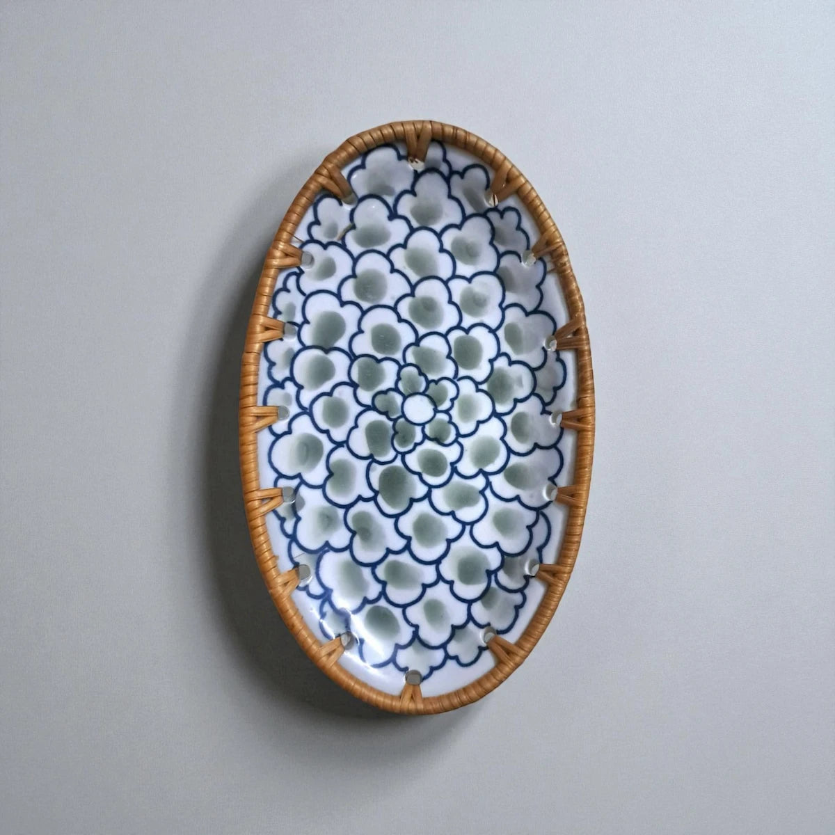 Oval ceramic tray with rattan edge, Sage Bloom pattern, front view
