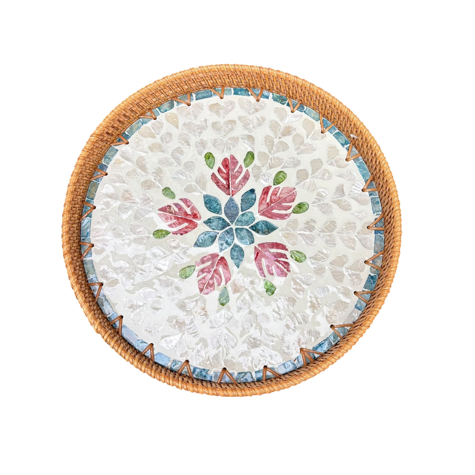 Round mother-of-pearl decorative tray with rattan rim and floral mosaic on a white background