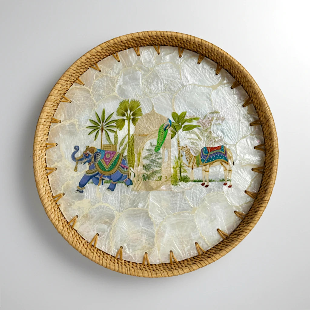 Round mother-of-pearl mosaic tray with hand-woven rattan rim — Royal Oasis motif (elephant, palms & camel)