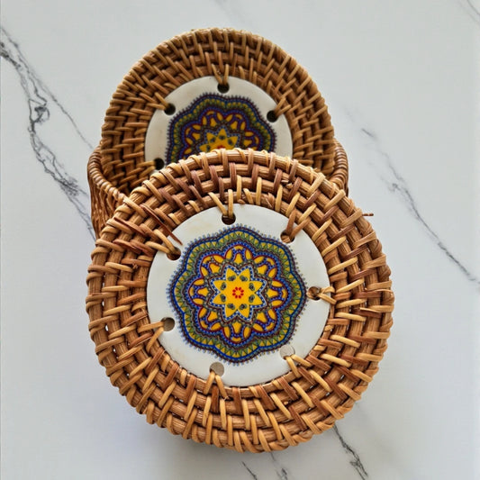 Sunlit Blue Ceramic Rattan Coasters on a marble countertop