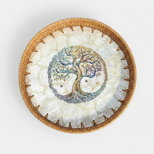 Round Tree of Life tray with mother-of-pearl mosaic and hand-woven rattan rim on off white background