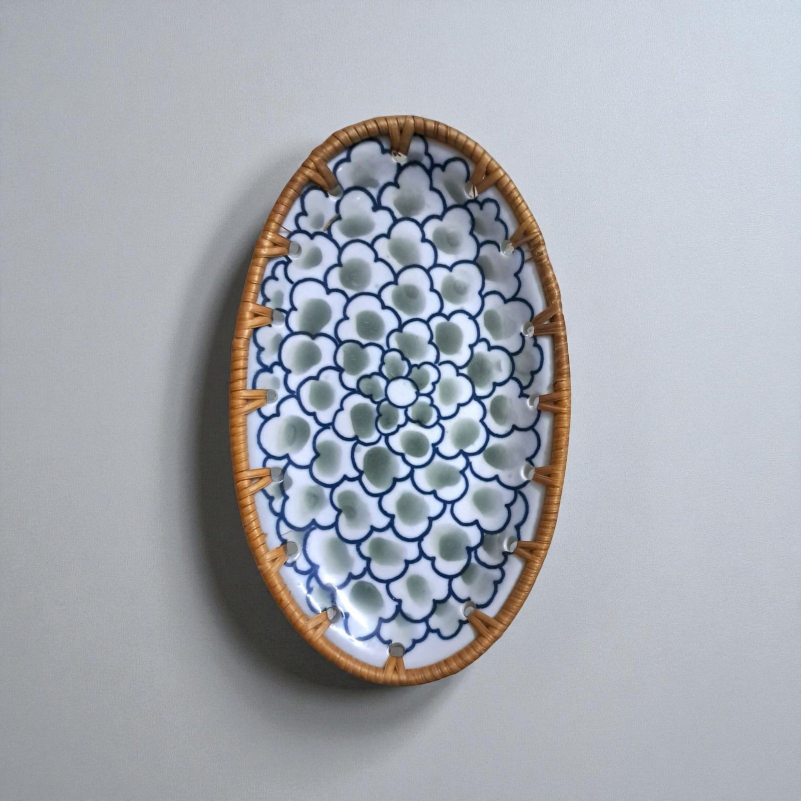 Oval ceramic tray with rattan edge, Sage Bloom pattern, front view