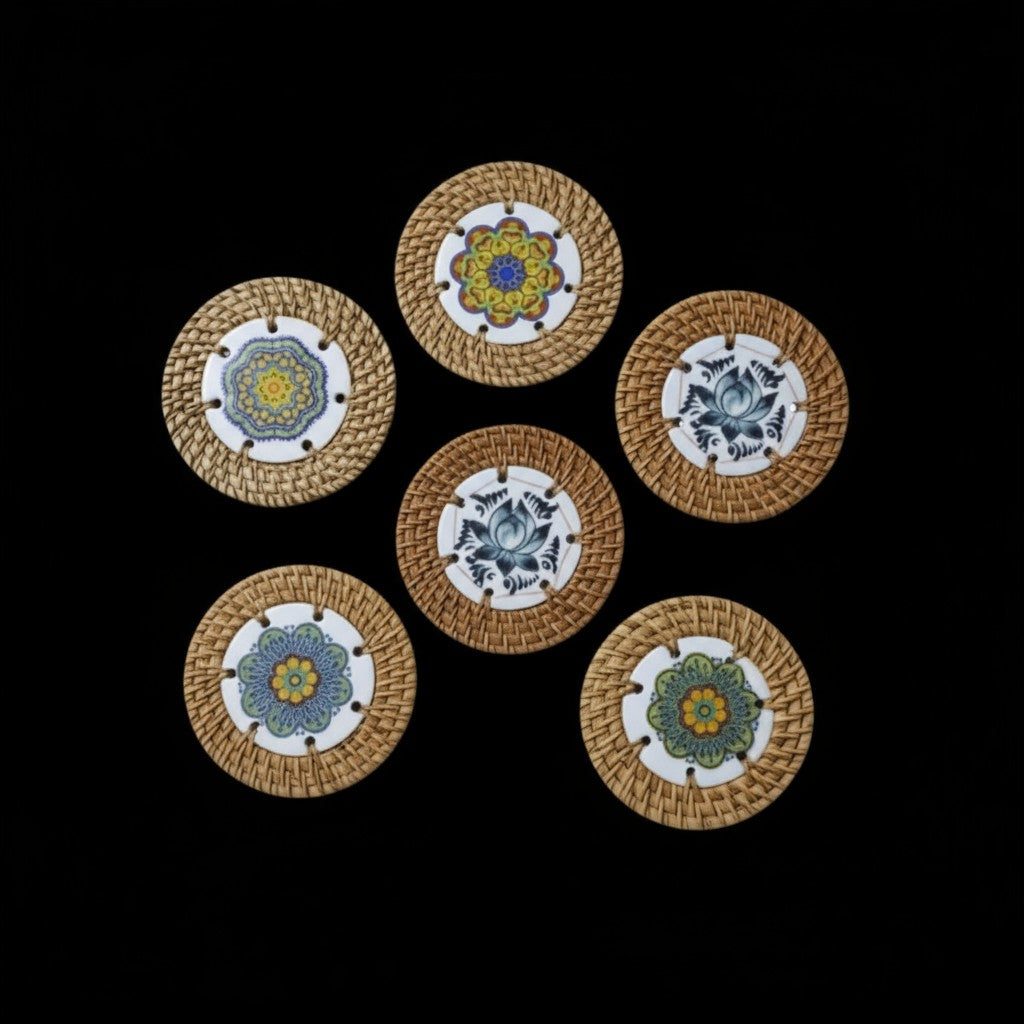 Six decorative rattan coasters arranged in a circle on black background