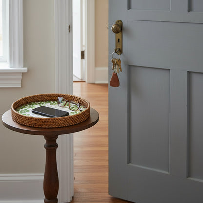 Round mother-of-pearl tray on a pedestal side table – decorative accent styling.