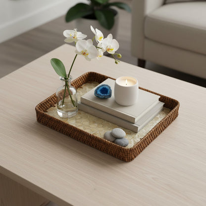 Coastal Pearl mother-of-pearl tray styled on a light wood coffee table with candles and orchids